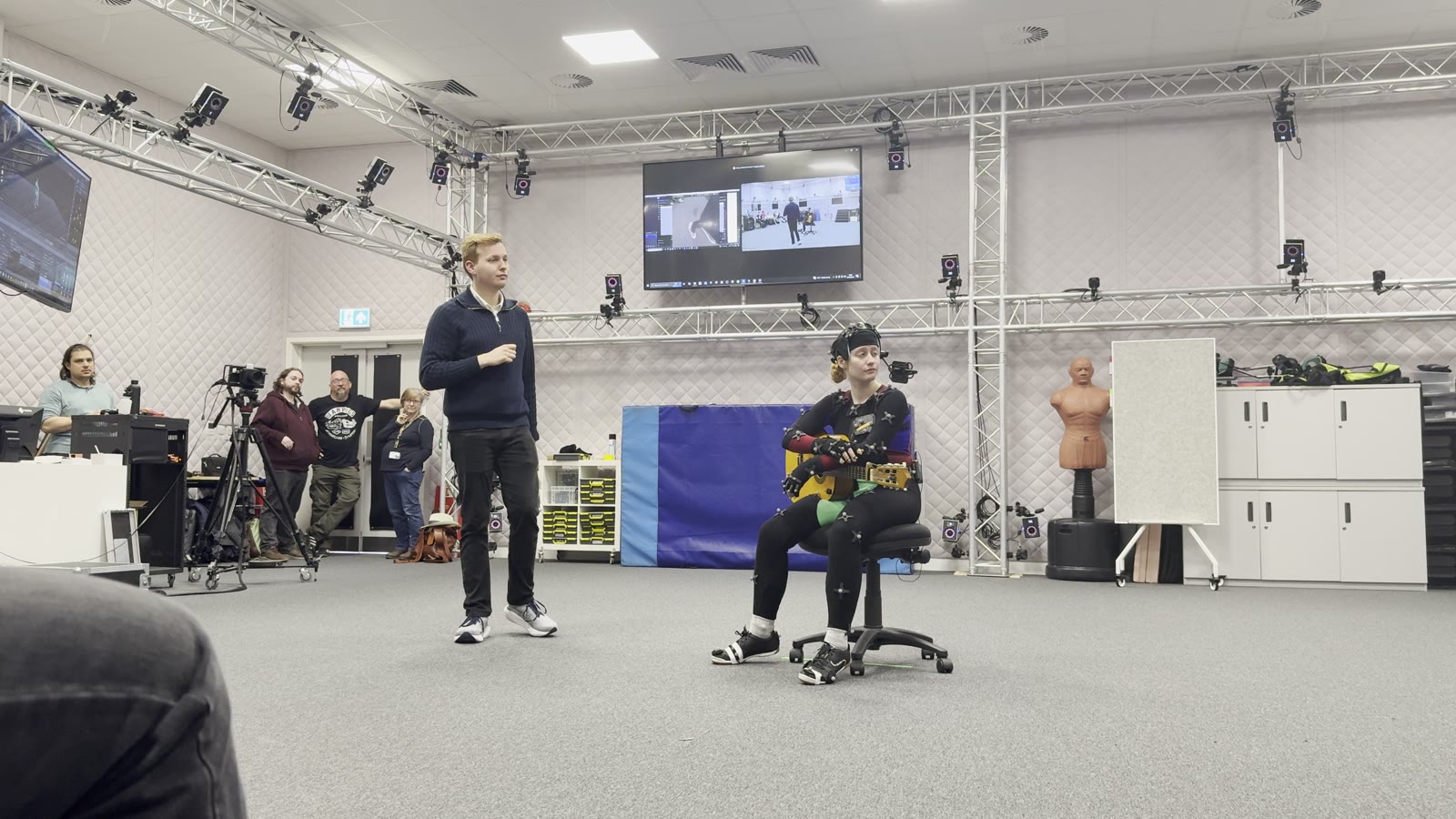 Performer in mocap suit on stage